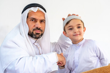 Arabic muslim father and son feeling happy together