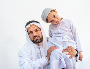 Obraz premium Arabic muslim father holding his son on his shoulder