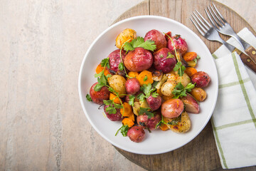 Multi Colored Food. Roasted or boiled Potatoes in bowl on light Background. top view