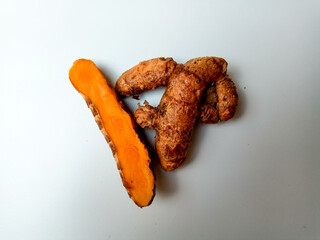 Turmeric or Curcuma longa rhizomes, isolated in white background