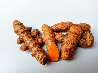 Turmeric or Curcuma longa rhizomes, isolated in white background