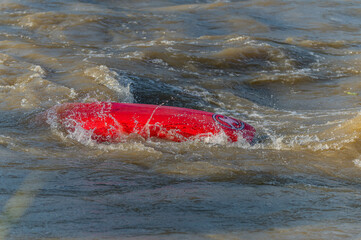 a kayaker rolling a kayak