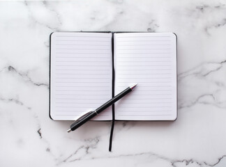 Notepad and pen on marble background