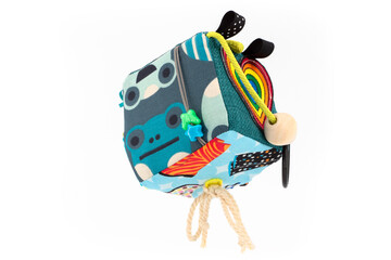 toy cube with colorful embroidery and decorations