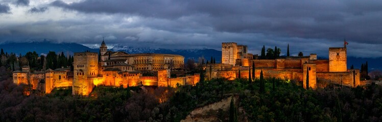 Fototapeta na wymiar Thunderclouds over the Alhambra. Night panoramic view of Alhambra. Andalusia, Spain