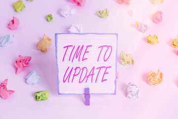 Conceptual hand writing showing Time To Update. Concept meaning System software update for enhancement or compatibility Colored crumpled paper empty reminder white floor clothespin