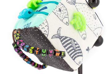 toy cube with colorful embroidery and decorations