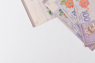 Malaysia Currency (MYR) Ringgit Malaysia bank note. Close up on money showing the first of Malaysian King on Rm100 notes.