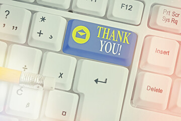 Writing note showing Thank You. Business concept for polite expression to acknowledge a gift,...