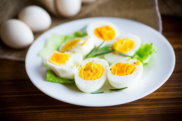 boiled eggs with salad leaves in a plate