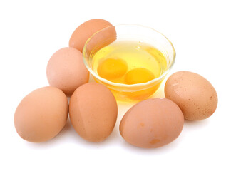 brown egg and glass bowl on white background