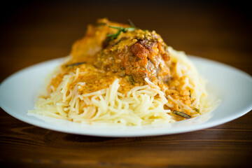 boiled vermicelli with meat and gravy in a plate