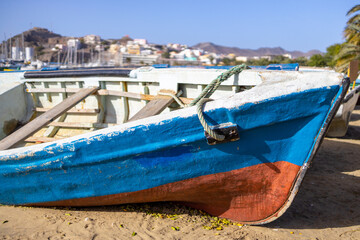 Fototapeta na wymiar Fisherboat on the beach of the city Mindelo, Island of Sao Vicente, Cape Verde