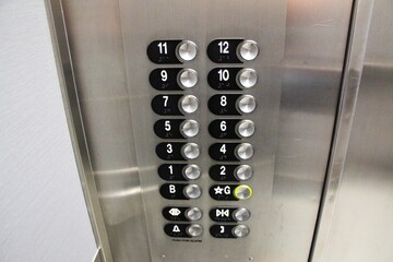 The detail on elevator buttons in the business building.