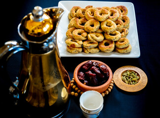 Coffee pot with cups and some date