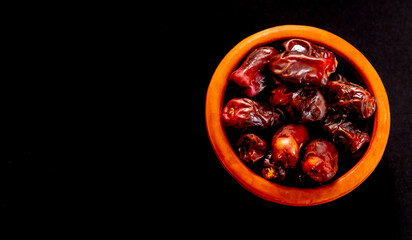 Small pot filled with dates