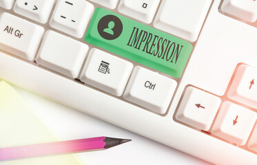 Word writing text Impression. Business photo showcasing an idea and feeling or opinion about something or someone White pc keyboard with empty note paper above white key copy space