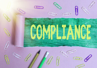 Writing note showing Compliance. Business concept for the action or fact of complying with a wish...