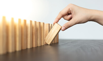 white woman plays Dominoes in the office.