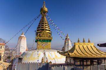 The Swayambhu Maha Chaitya stupa with a clear blue sky on the background