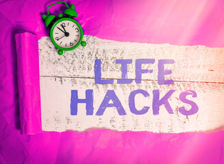 Writing note showing Life Hacks. Business concept for strategy or technique adopted to manage...