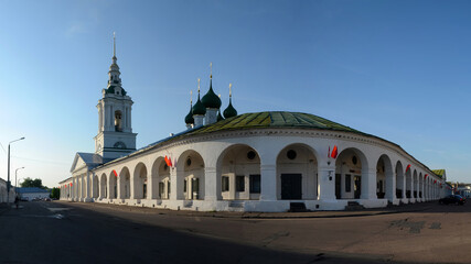 Panoramic view of Gostiny Dvor (Krasnye ryady) with Saviour Church which  is the best preserved complex of provincial trading arcades  in the country. Kostroma town, Kostroma Oblast, Russia.