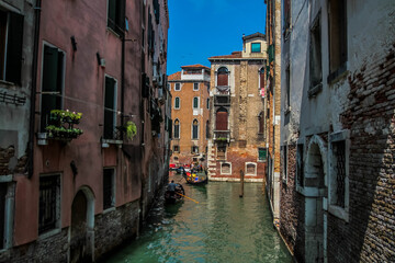 Fototapeta na wymiar Amazing view on the beautiful Venice, Italy. Many gondolas sailing down one of the canals.
