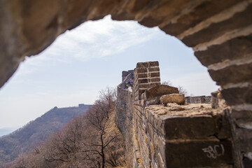 Beijing, China - CIRCA 2020: Great Wall of China in a green forest landscape at Mutianyu in Huairou...