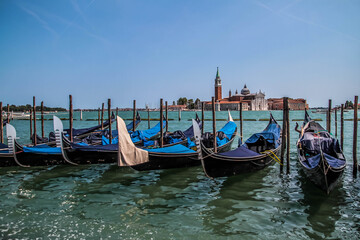 Fototapeta na wymiar Gondolas moored by Saint Mark square in Venice, Italy