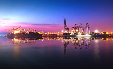 Reflection at dock Terminal of Logistics Containers cargo. Import and export industry