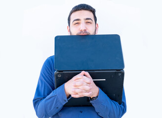 Arabic guy holding laptop in his hands