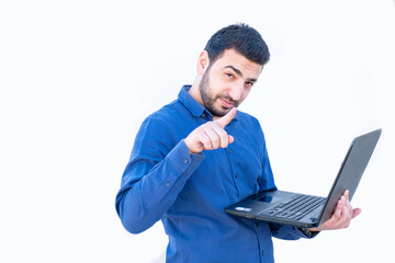 Arabic guy holding laptop in his hands