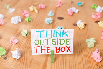 Conceptual hand writing showing Think Outside The Box. Concept meaning Learn to adopt new ideas and...