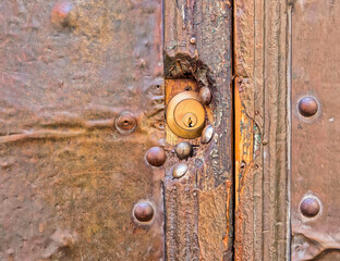 old brown wood and metal door lock detail, space for text