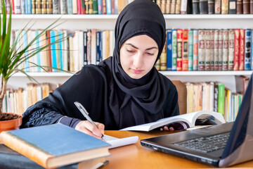 Arabic muslim woman studying online