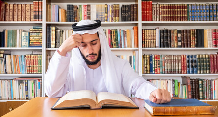 Arabic muslim man reading old books