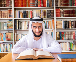 Arabic muslim man reading old books