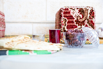 Arabic sit with date and water and juice preparing for iftar