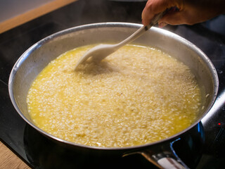 Risotto cooking in pan