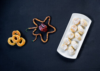 Muslim sweets for eid on some black table