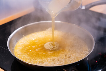 Risotto cooking in pan