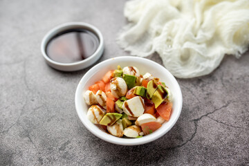 Home made avocado and tomato salad with fresh mozzarella and balsamic glaze  