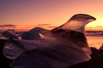 Sunrise on winter's day in Iceland, with icebergs on Diamond Beach