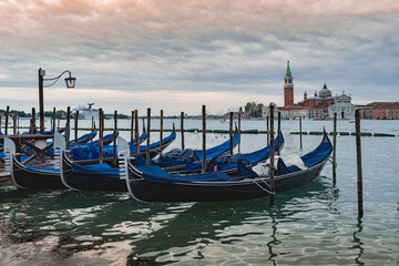 Obraz na płótnie Canvas Gondolas anchored by Piazza San Marco with San Giorgio di Maggiore church in Venice,