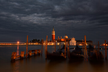 Fototapeta premium Church of San Giorgio Maggiore at night with city lights, Venice
