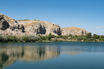 landscape of rocks and water in the lagoon of the campillo in Rivas Vaciamadrid in Madrid Spain