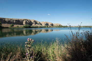 landscape of rocks and water in the lagoon of the campillo in Rivas Vaciamadrid in Madrid Spain