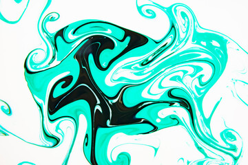 The background is painted blue in the Ebru style