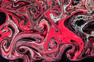 The background is painted in black and red in the Ebru style
