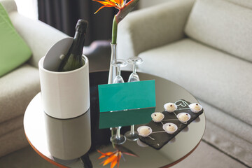 Congratulations to the newlyweds upon checking in at the hotel. A bottle of champagne, candy and...